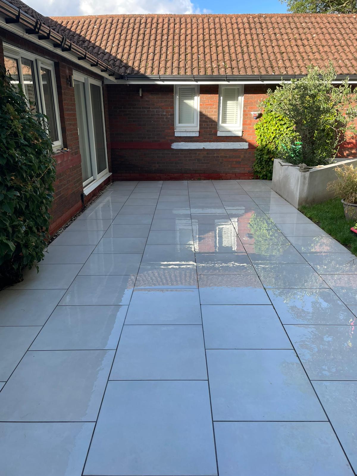 Patio after pressure washing — gleaming